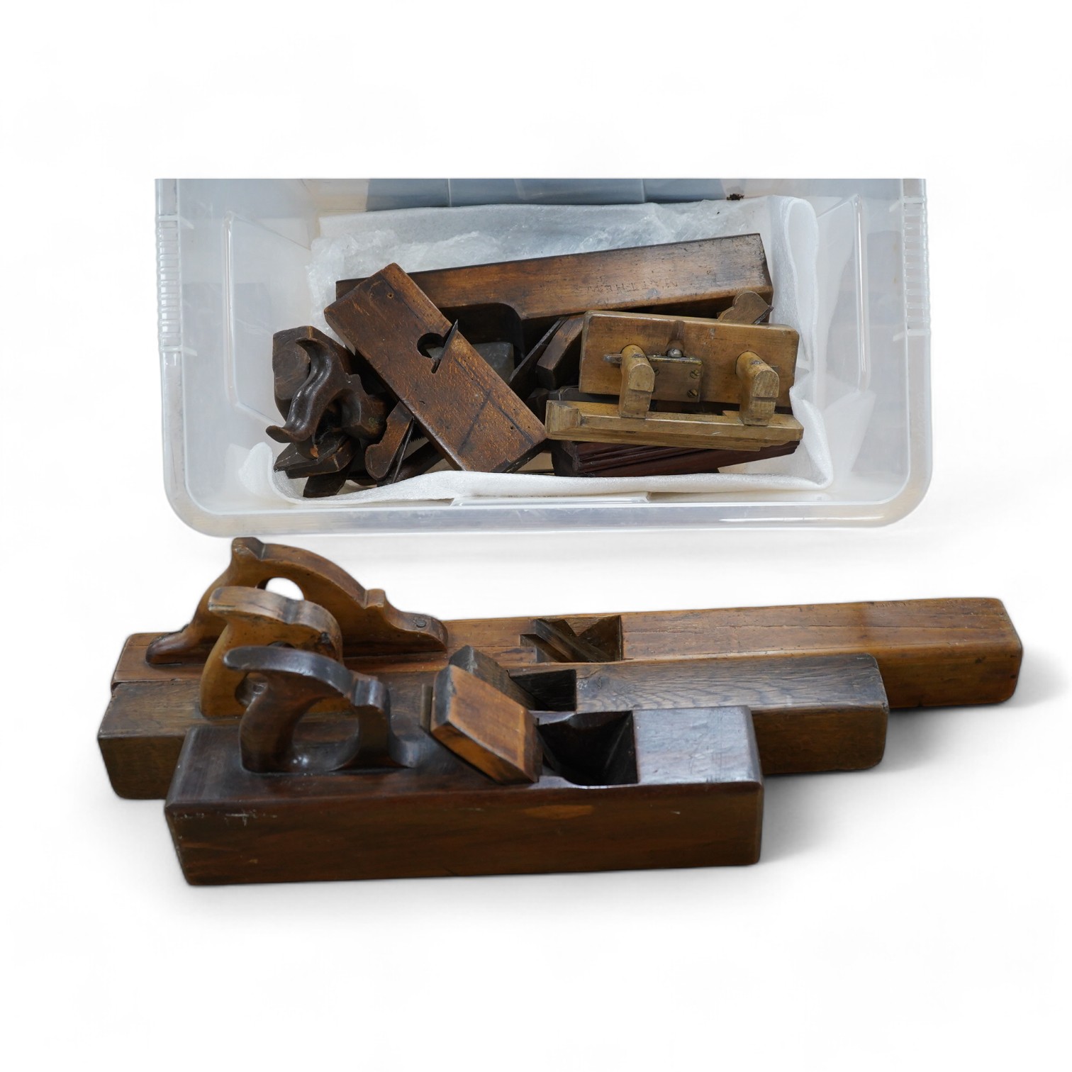 A collection of wooden carpenters tools, including various planes, two saws and a marking gauge, longest plane 73cm long. Condition - some blades missing